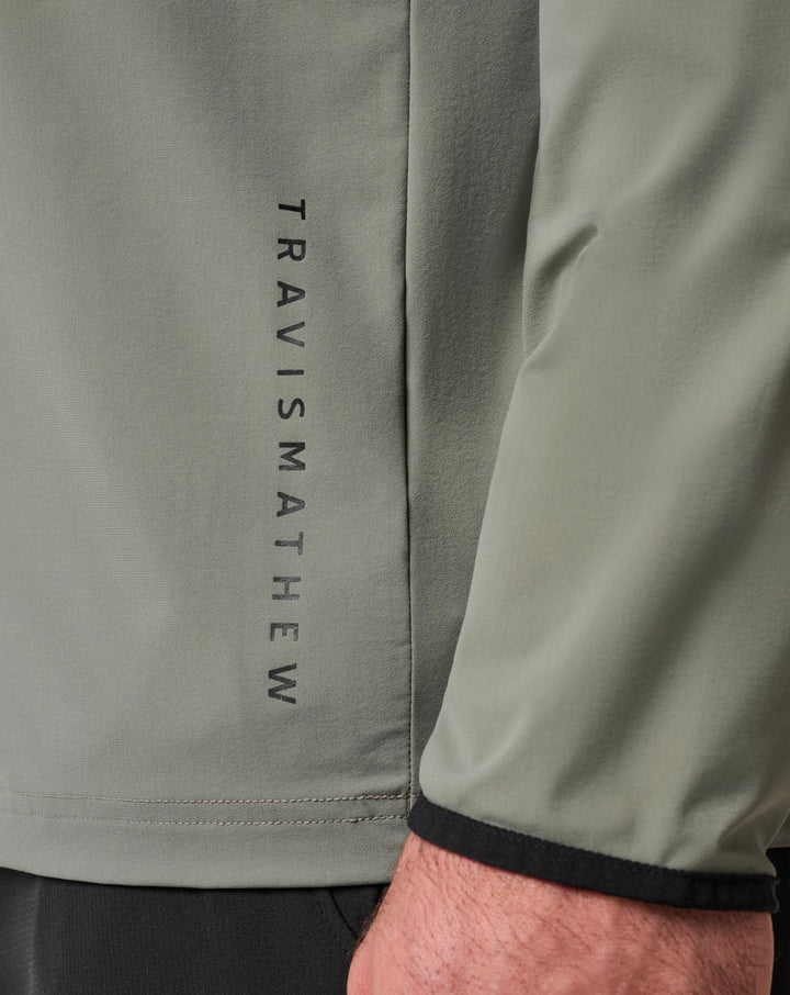 <img src="https://cdn.shopify.com/s/files/1/0252/0927/4404/files/TM-Combo-Logo-Block-Black-650.png?v=1580931784" alt=" TravisMathew Brand logo" align="middle" style="border:0;"><p><p>Hero Hour Tech Hoodie</p>